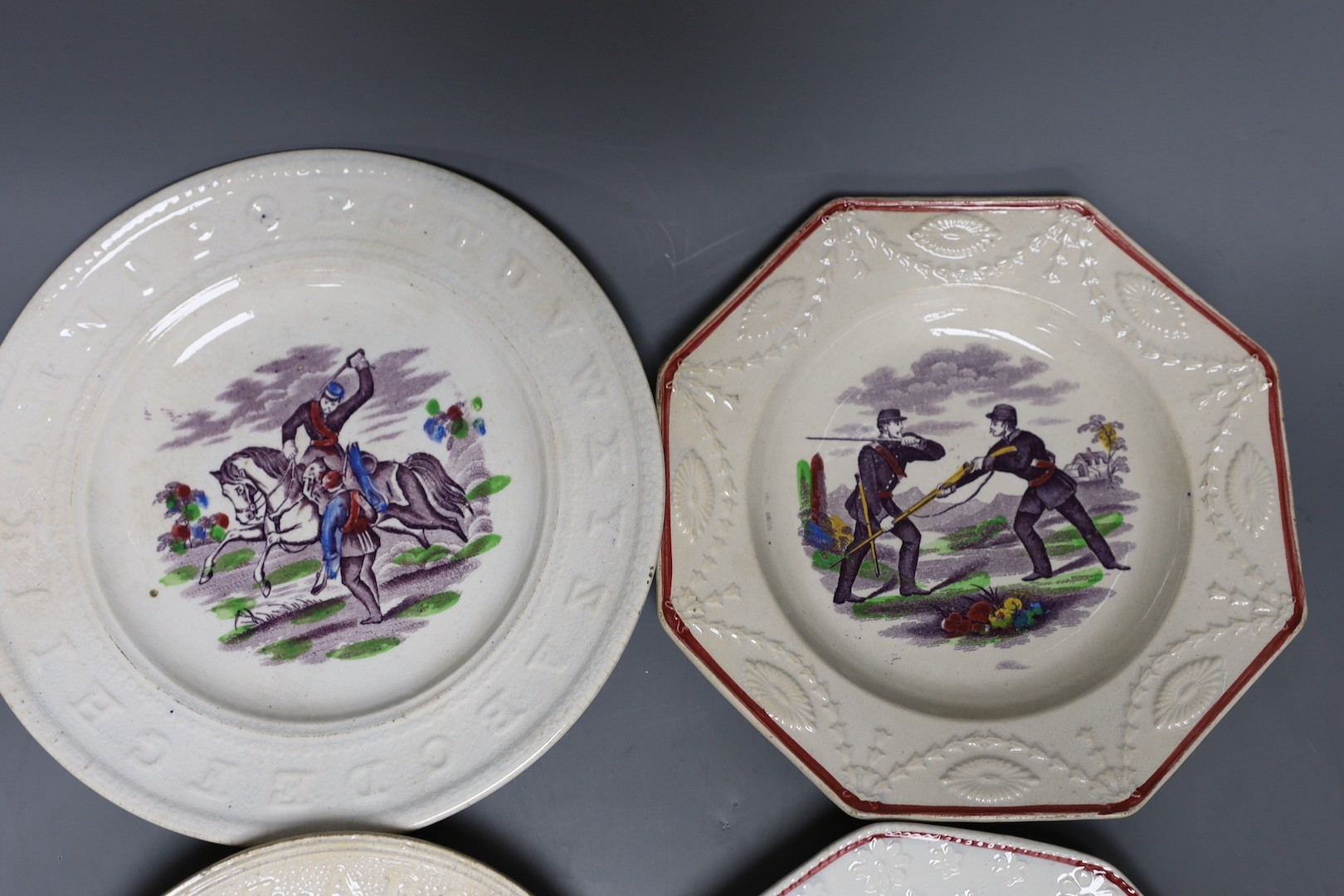 A group of mid-19th century Staffordshire rifle brigade and Crimean war commemorative nursery ceramics, Largest 21 cm